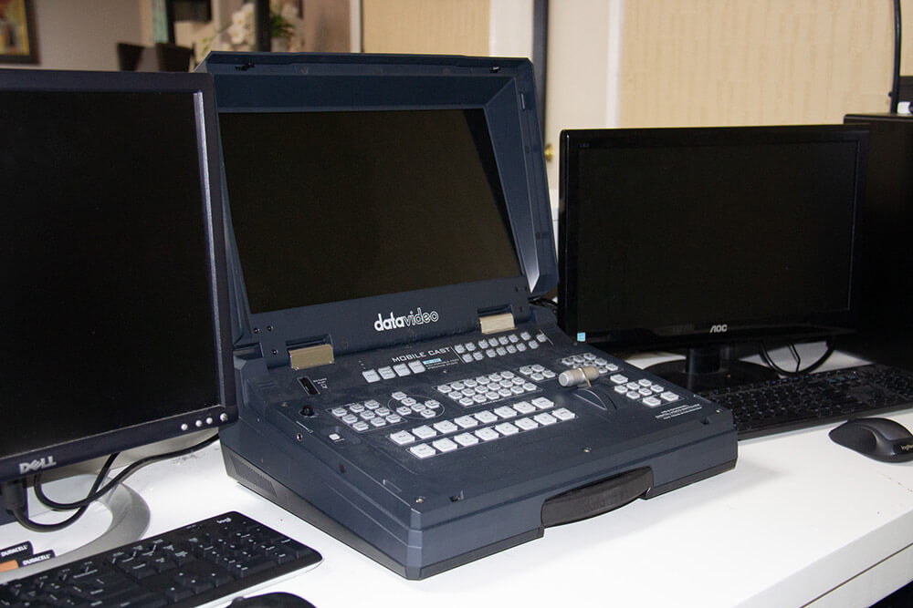 Datavideo portable production studio and two monitors with keyboards