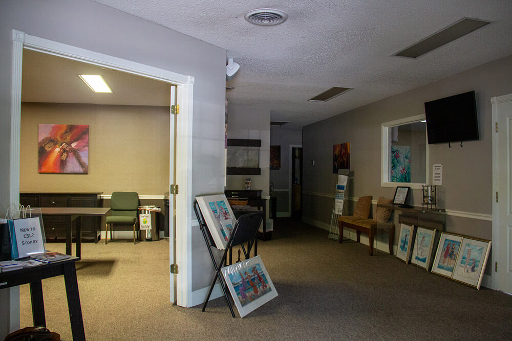 Hallway in interior of building with artwork set up
